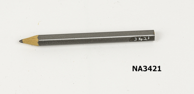 A small grey commemorative pencil 