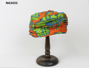 Brimless, pleated, close fitting hat. 