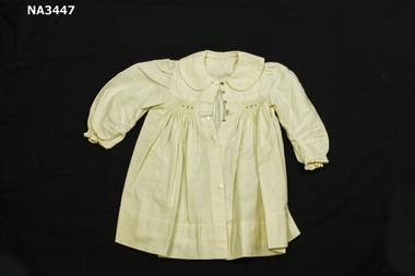 A cream viyella coat with Peter Pan collar, 