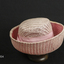 Pink straw hat with deep, off the face, brim. 