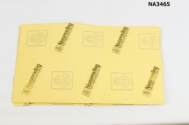 A part of sheet of yellow wrapping paper 