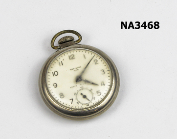 A silver pocket watch case with a white face and black hands and numbers. 