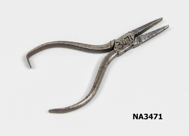 Steel pliers pointed at nose. 
