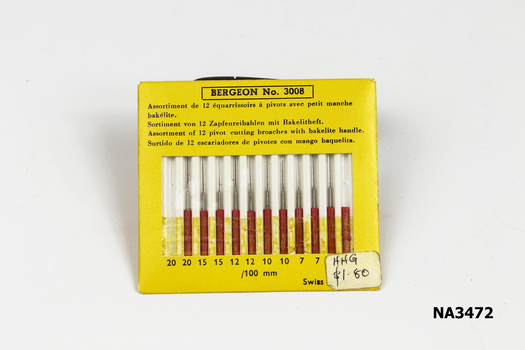 Packet of eleven pins (broaches) with red bakelite handles