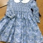Blue floral childrens dress, smocked to the waist. 