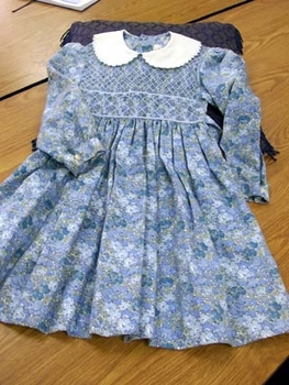 Blue floral childrens dress, smocked to the waist. 