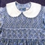 Blue floral childrens dress, smocked to the waist. 