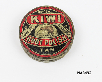 Round tin painted black and red with gold lettering. 