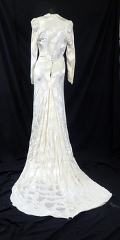 Cream damask 1938 satin dress. Long sleeves, cross over neckline to a diamond front panel. (back view)