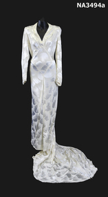 Cream damask 1938 satin dress. Long sleeves, cross over neckline to a diamond front panel
