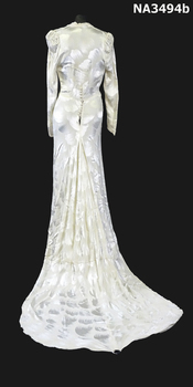 Cream damask 1938 satin dress. Long sleeves, cross over neckline to a diamond front panel. 