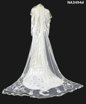 Cream damask 1938 satin dress. Long sleeves, cross over neckline to a diamond front panel.