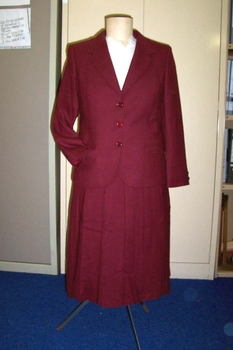 1980 Burgandy wool women's pleated skirt and three buttoned jacket. 