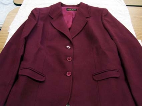 1980 Burgandy wool women's pleated skirt and three buttoned jacket. 
