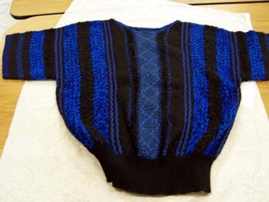 1987 Two piece black woollen suit. 