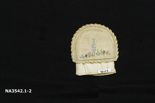 Small semi circular shaped cream linen egg cosy