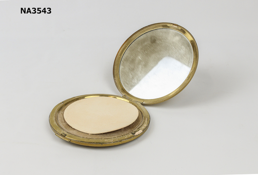 Round gold compact, 