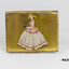 Oblong gilt case with pink enamel on lid.