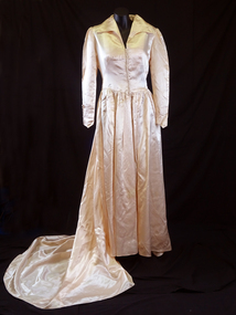  1950's Magnolia satin, vee neckline with collar, button and loops to vee shaped waist.(front)