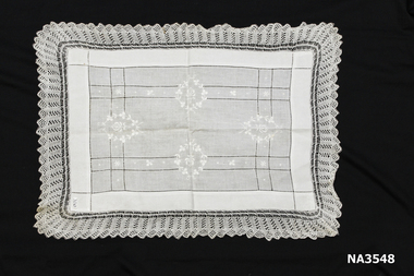 Cream linen, drawn thread and cream embroidered.