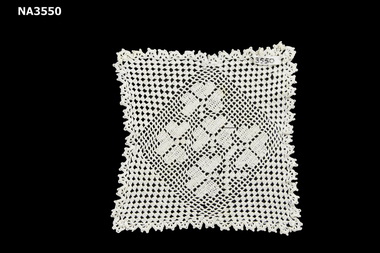 Square hand crocheted doiley. 