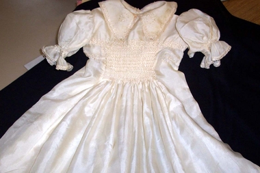  Cream silk smocked baby's dress, embroidered collar and yoke, smocked sleeves. 