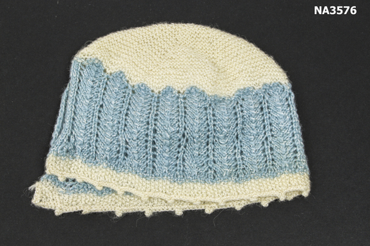 1924 blue and cream wool and silk knitted child's bonnet