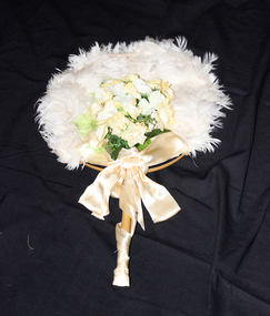 1886 bamboo fan mounted with white feathers.
