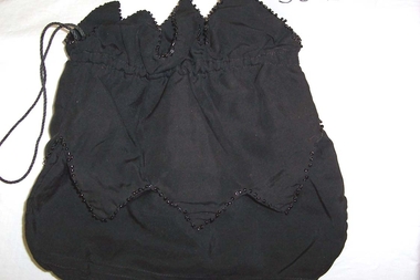 1900 black silk draw string evening bag trimmed with black beads. 
