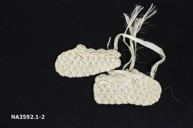 Cream silk crocheted booties, 1929, 
