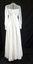 White chiffon 1978 round neck line dress with high waist, long sleeves; with cuff and six covered buttons.(back))