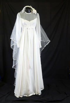 White chiffon 1978 round neck line dress with high waist, long sleeves; with cuff and six covered buttons (front with veil)