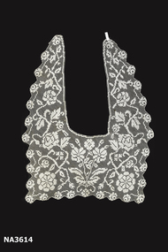 A cream filet lace collar, handmade.