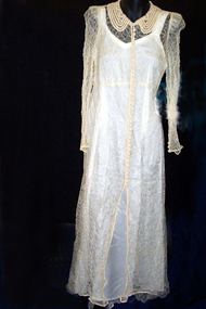 Cream machine lace long sleeved wedding dress with faggotted collar from 1930s.