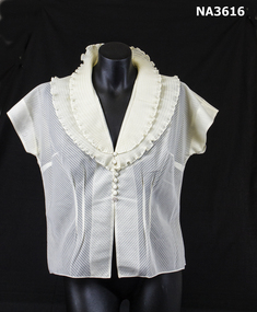 Cream nylon blouse with double collar which is pleated with ruffled edge. 