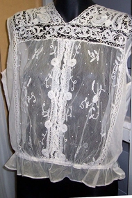 V neck sleeveless lace panel front.