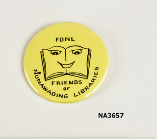 Round cream badge with stylised book in the centre 