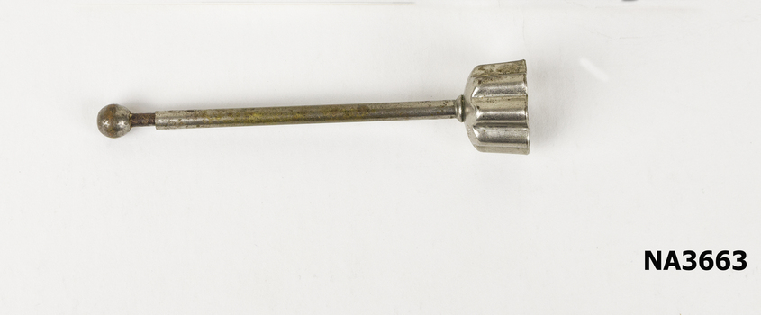 Small metal pastry cutter. Fluted edging and long plunger which retracts.
