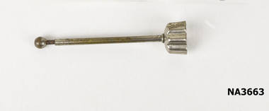 Small metal pastry cutter. Fluted edging and long plunger which retracts.