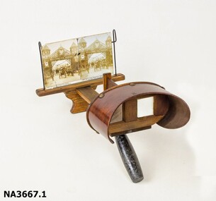 Stereograph made of wood. Two windows with magnifying glass in each. 