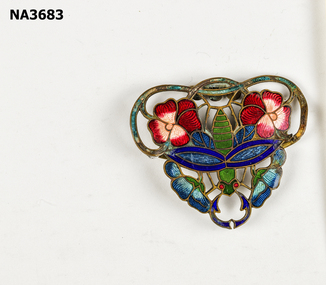 Art deco decorated with red and pink flowers with green leaves and blue motif in centre. NB this is one half of buckle