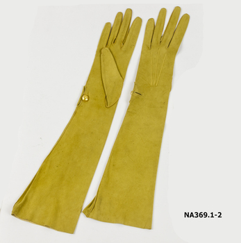 Pair lemon kid gloves, elbow length.  1 lemon pearl button