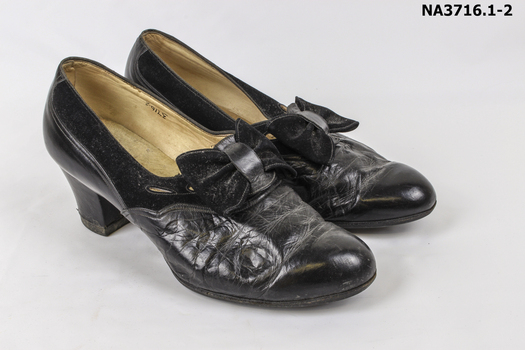 Black leather and suede court style shoes.