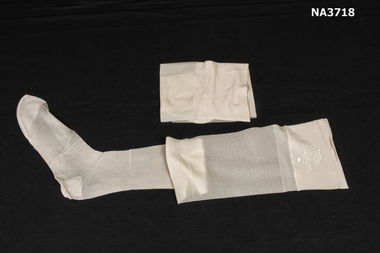 Paper backed nylon stockings in cellophane packet
