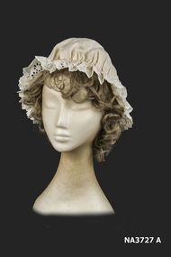 White cotton night cap with broderie anglaise edging