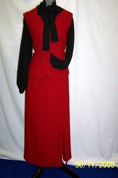 1980's black polyester blouse with yoke and tie neckline.