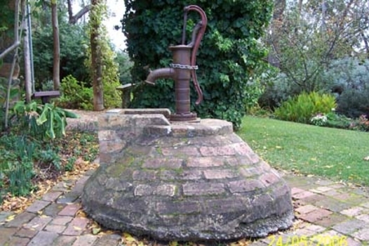 Physical description  A reconstructed well of red bricks.