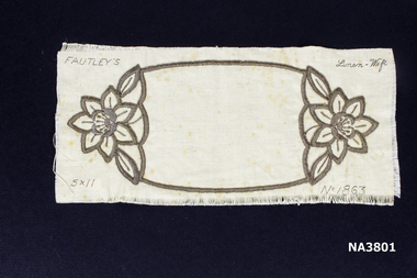 Unfinished piece of cutwork in shape of oblong doiley. 