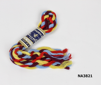 Plait contains red, yellow, maroon, blue threads