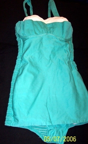 Pale green swimsuit, cream pin tuck insert forming the bra top. 